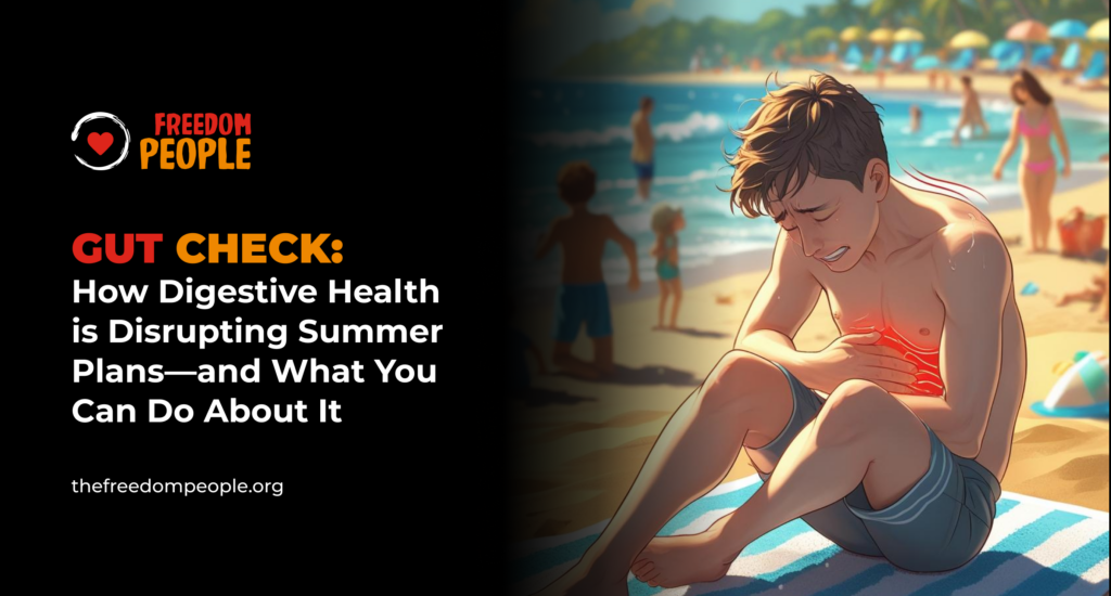 Young man holding his stomach in pain on a beach, surrounded by vacationers