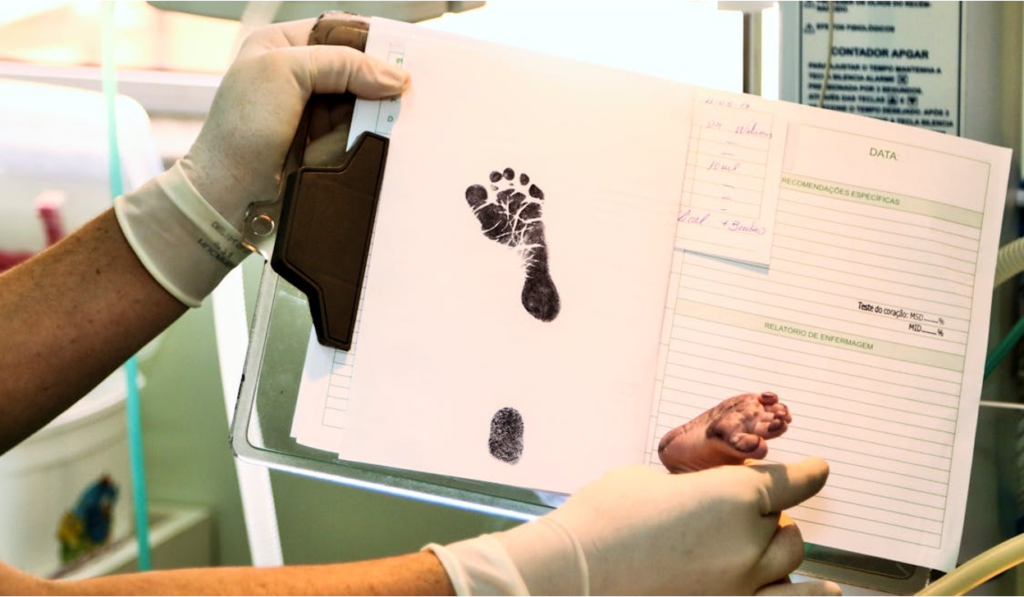Baby footprint stamp on paper, representing the birth registration process