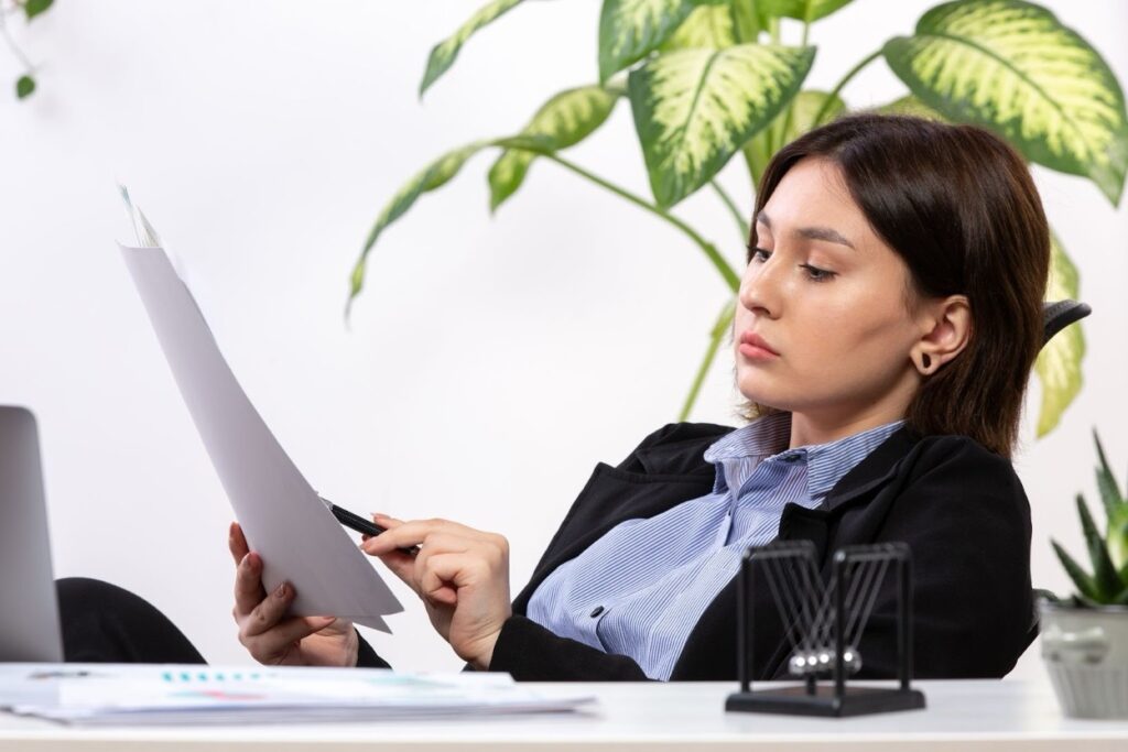 A nonprofit consultant reviewing IRS classification documents at a desk