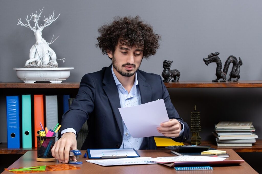 Accountant reviewing nonprofit tax documents at a desk.