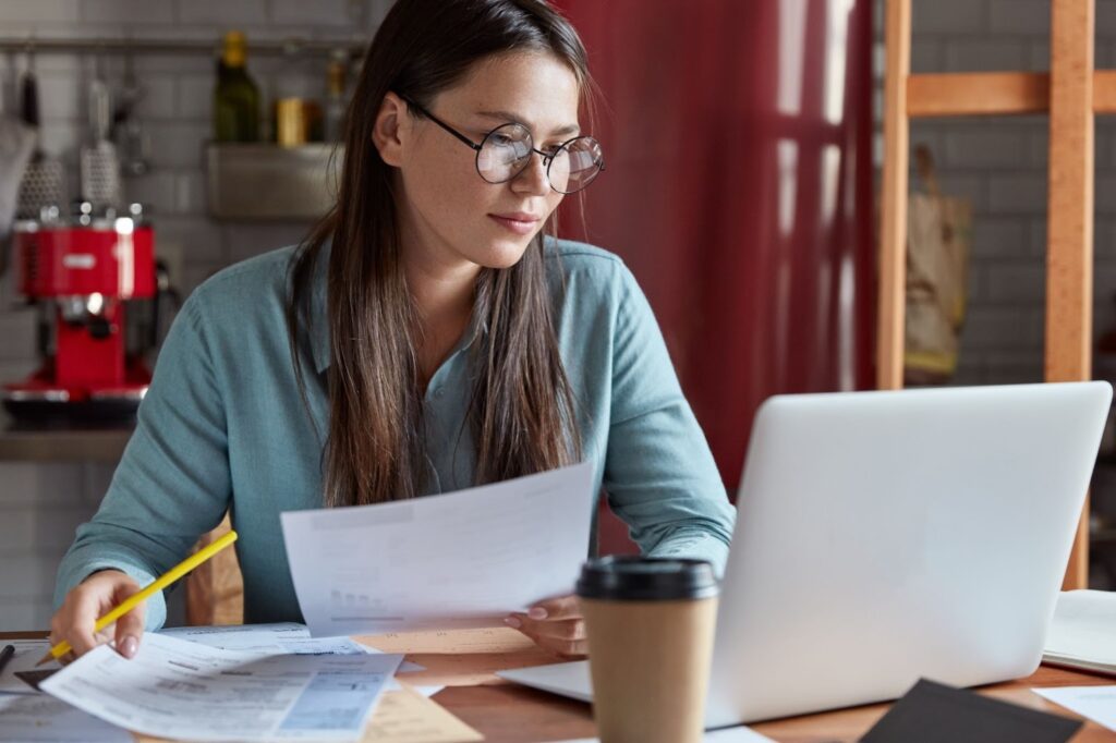 A nonprofit director reviewing application documents.