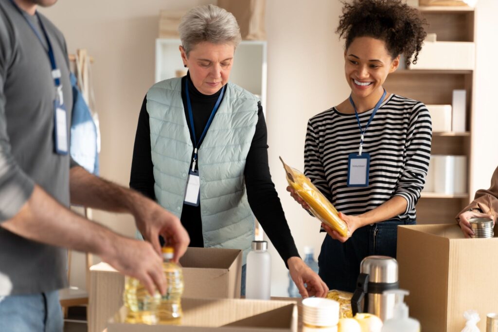 Community volunteers organizing donations at a charitable nonprofit.