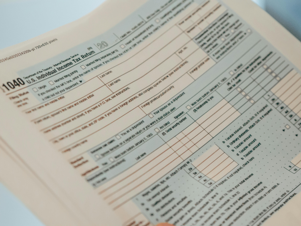 Close-up of a blank IRS Form 1040 U.S. Individual Income Tax Return document on a light surface.