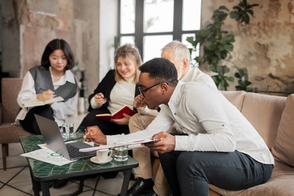 Family sitting with a legal advisor reviewing a trust document.