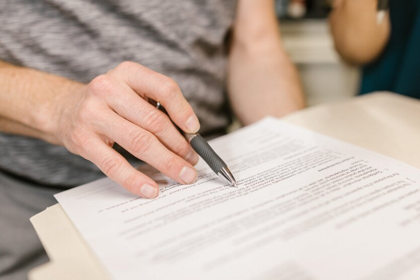 Older person reviewing a trust document, a common alternative to an LLC for asset protection.