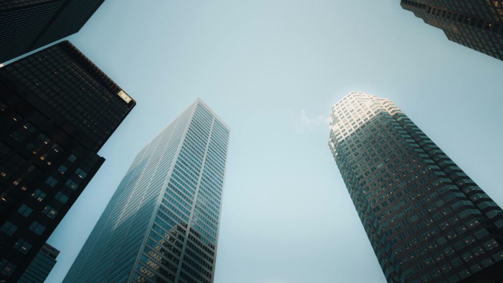 Glass skyscrapers representing S corporations as a tax-driven alternative to an LLC.