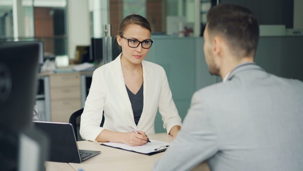 A trust advisor reviewing planning documents with a client during a consultation