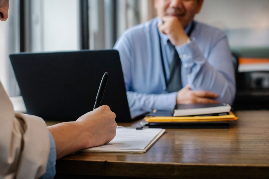 A person signing a trust document, the moment that often sets its future tax treatment. 