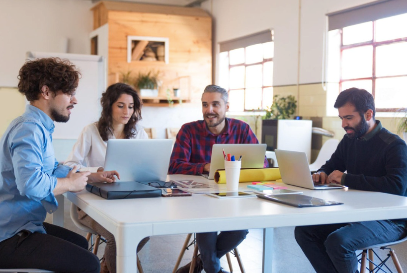 A group of people discussing the possibility of forming an irrevocable trust. 