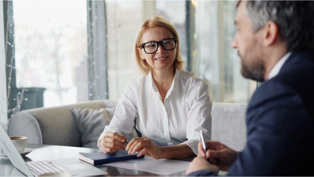A nonprofit founder and a tax advisor reviewing classification options during a consultation
