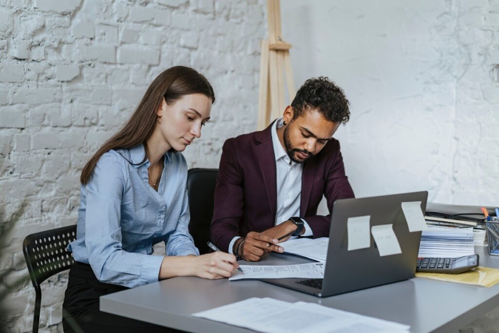 Professionals reviewing tax documents for nonprofit classification planning.
