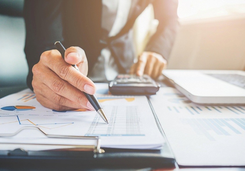 A businessman analyzing federal income tax exemptions for 501(c)(4) and 501(c)(6) organizations. 