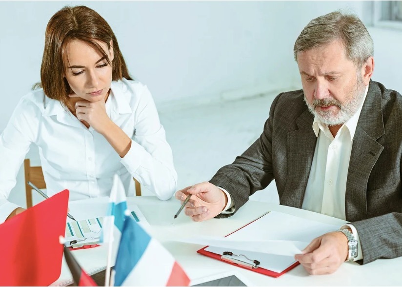 A financial advisor explaining the costs involved in forming an offshore asset protection trust. 